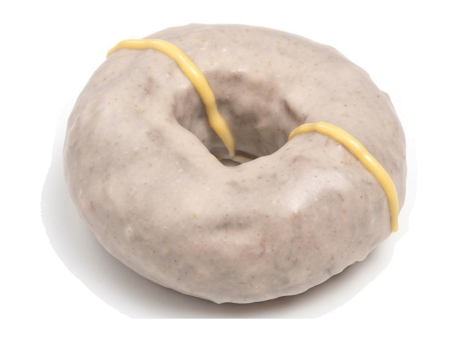Gluten-free chocolate doughnut with banana glaze and a cream drizzle